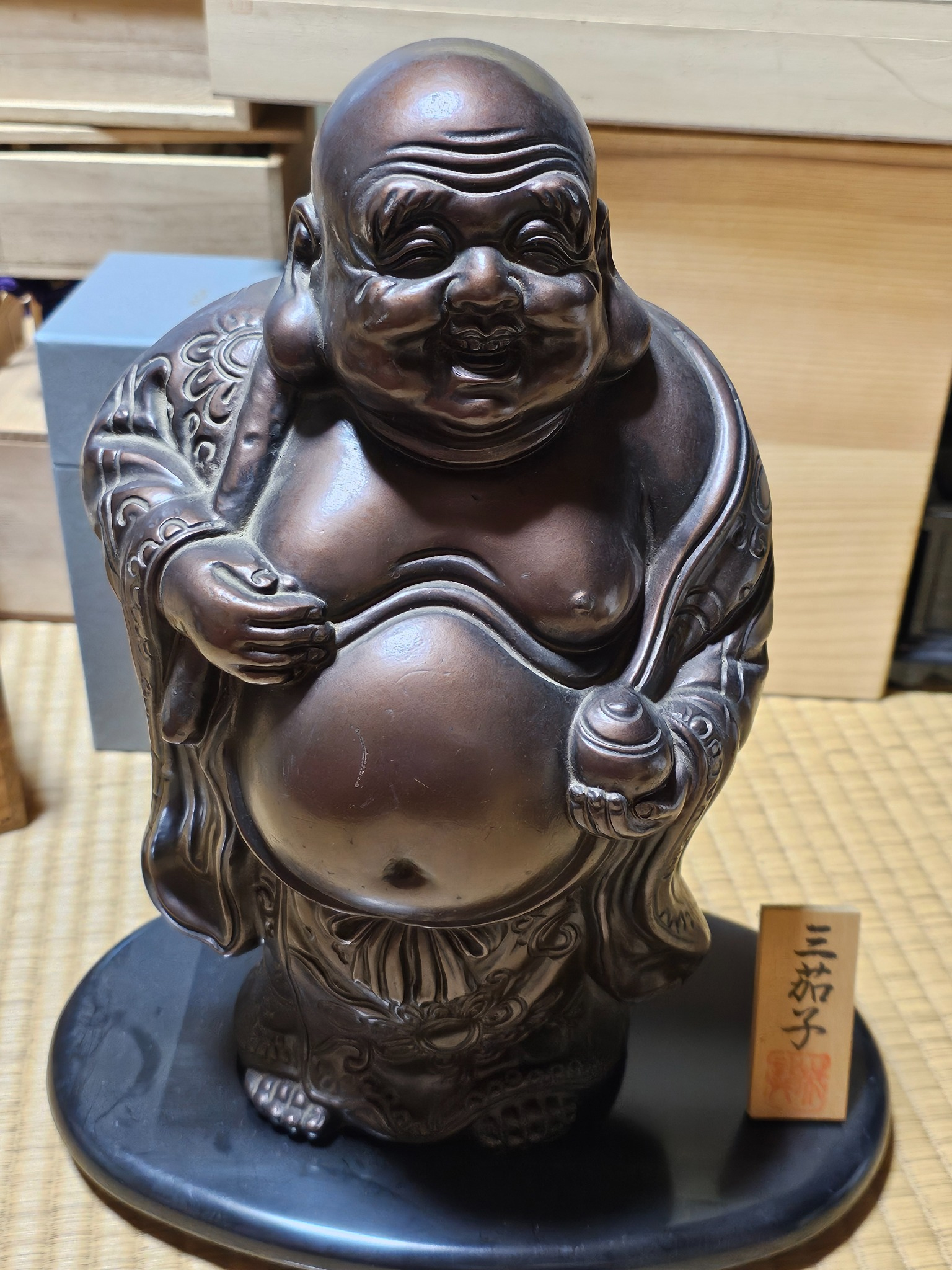 Hotei laughing fortune figure.