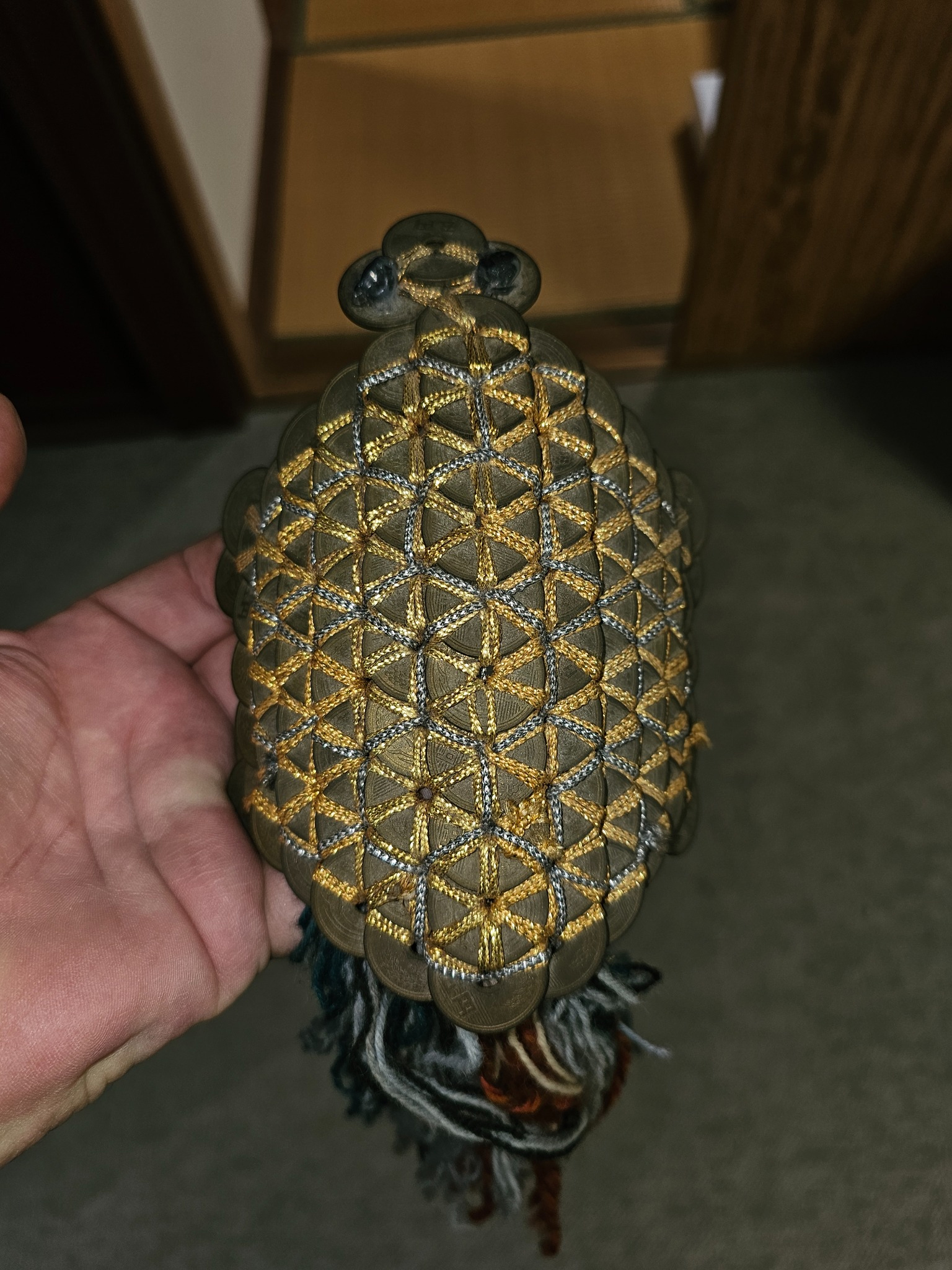 Old coin woven money charm.