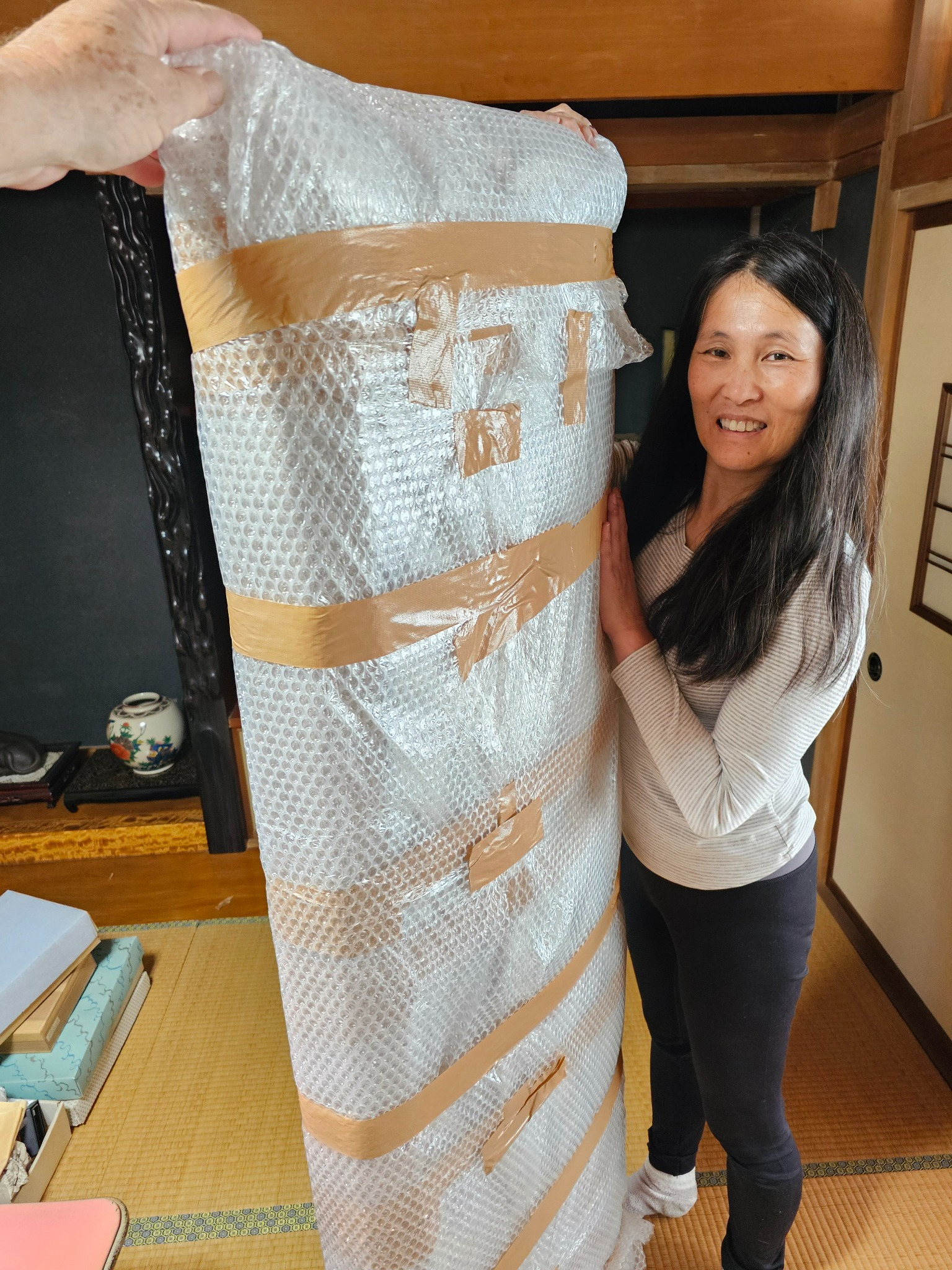 Tomoko with the wrapped ranma for preservation.
