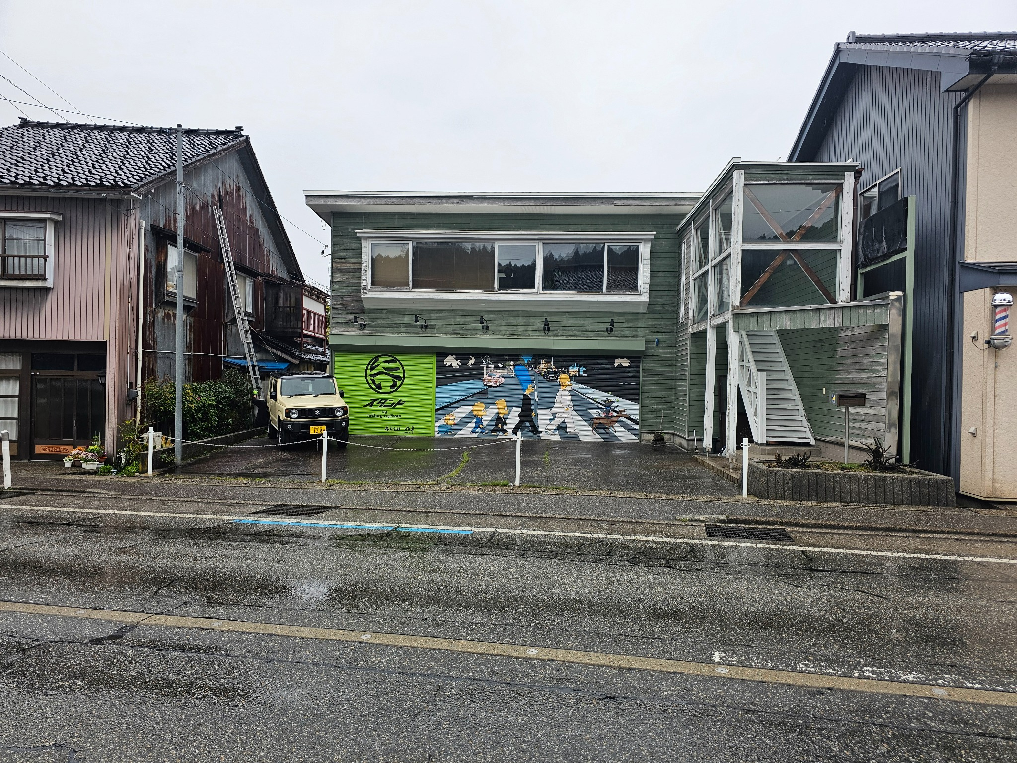Takkyubin shop with Beatles shutter mural.