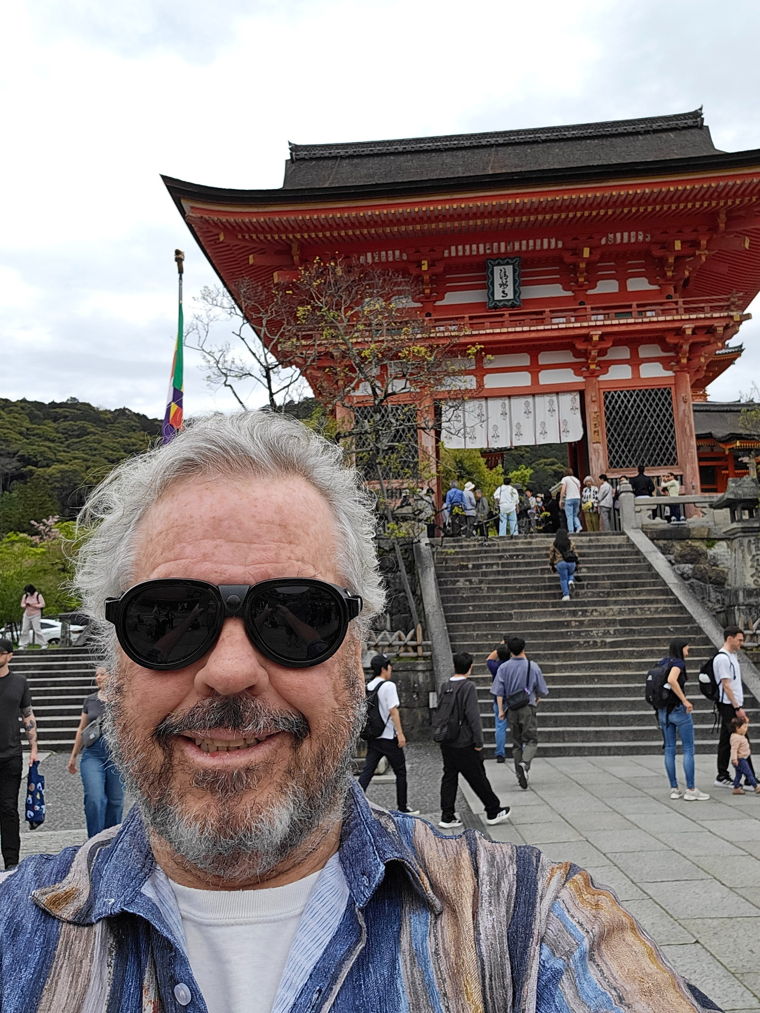 Arrival self portrait at a vermilion gate in Kyoto.