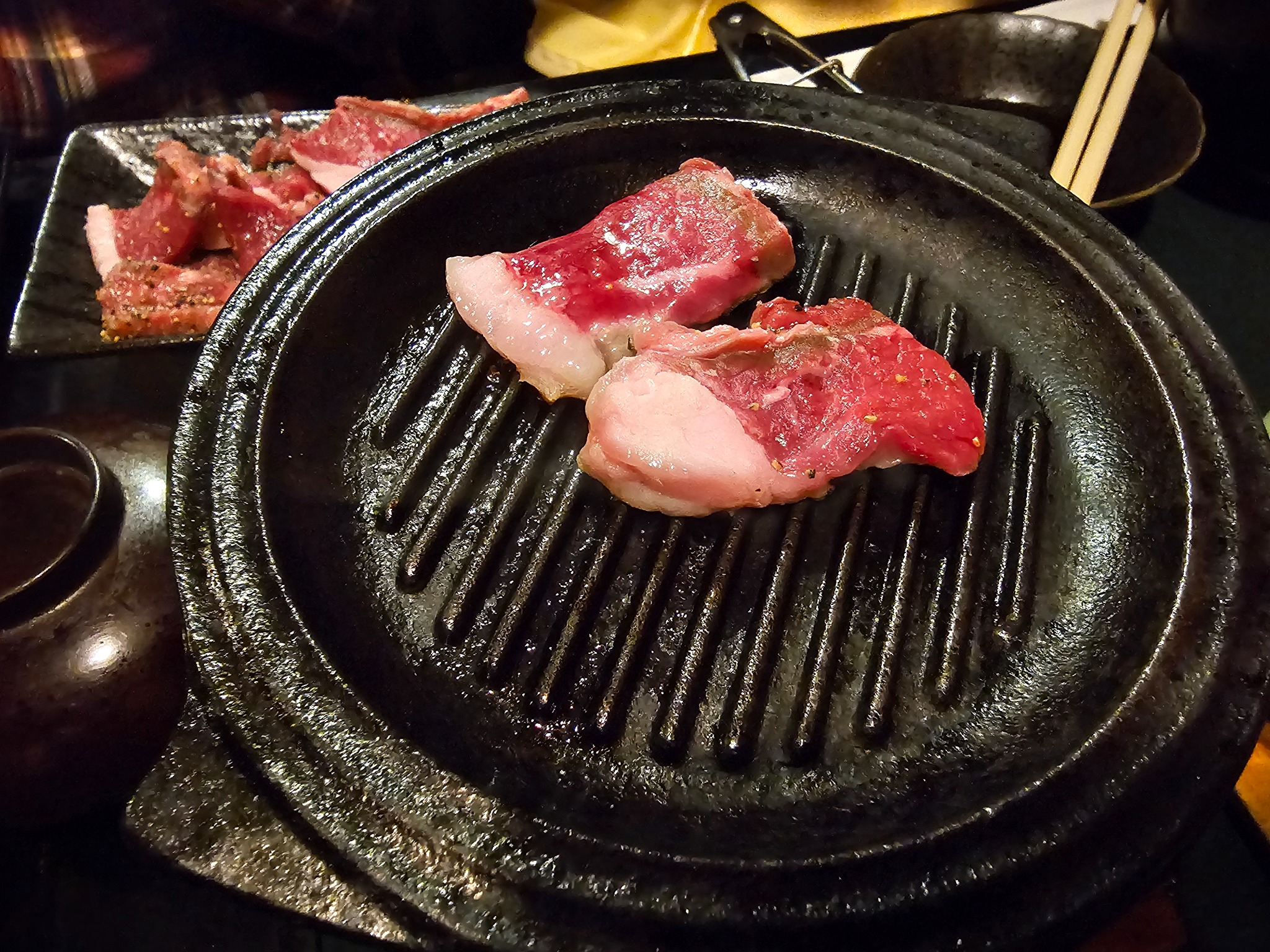 Raw lamb on tabletop grill.