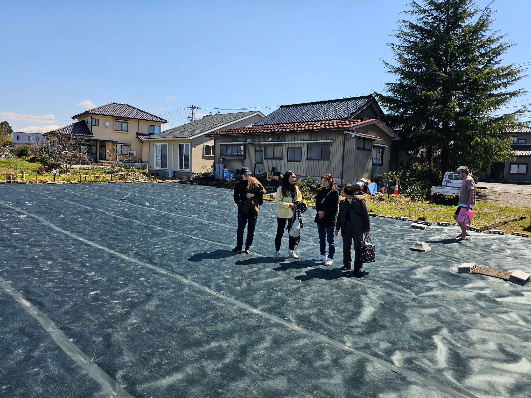 Cleared land with family walking in Hanasaki.