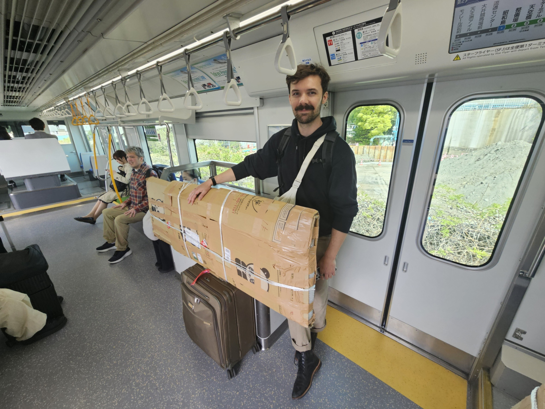 Friend with the packed box on the monorail.