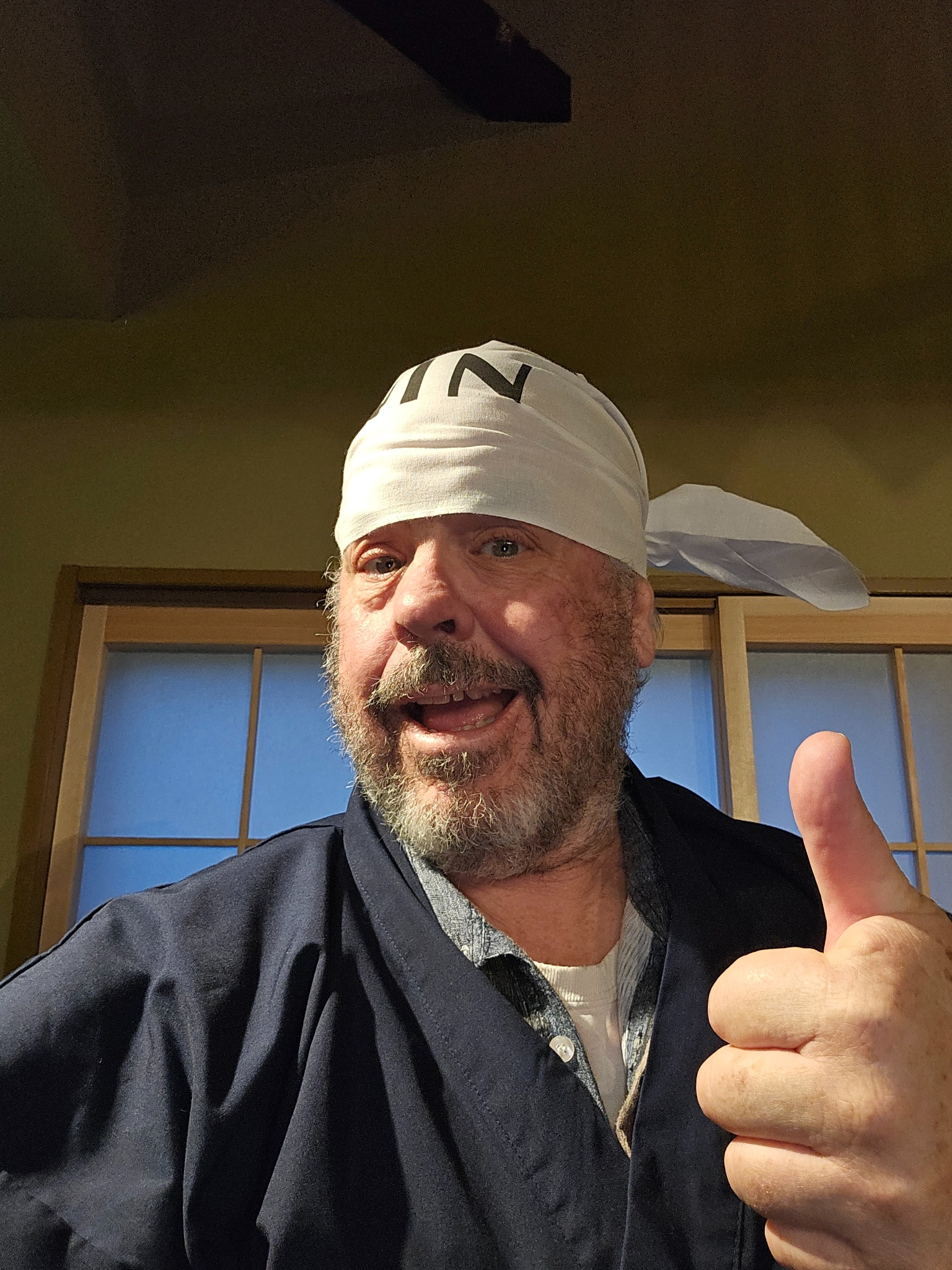 Brad in ninja headcloth with thumbs up.