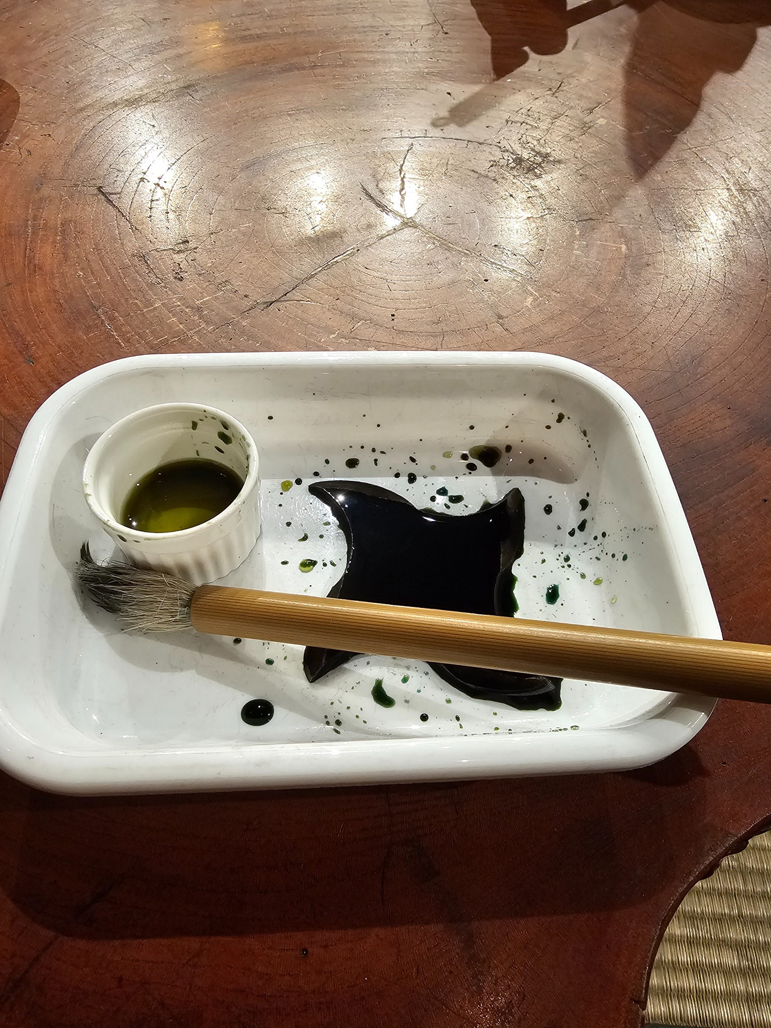 Finished shuriken with brush and patina.