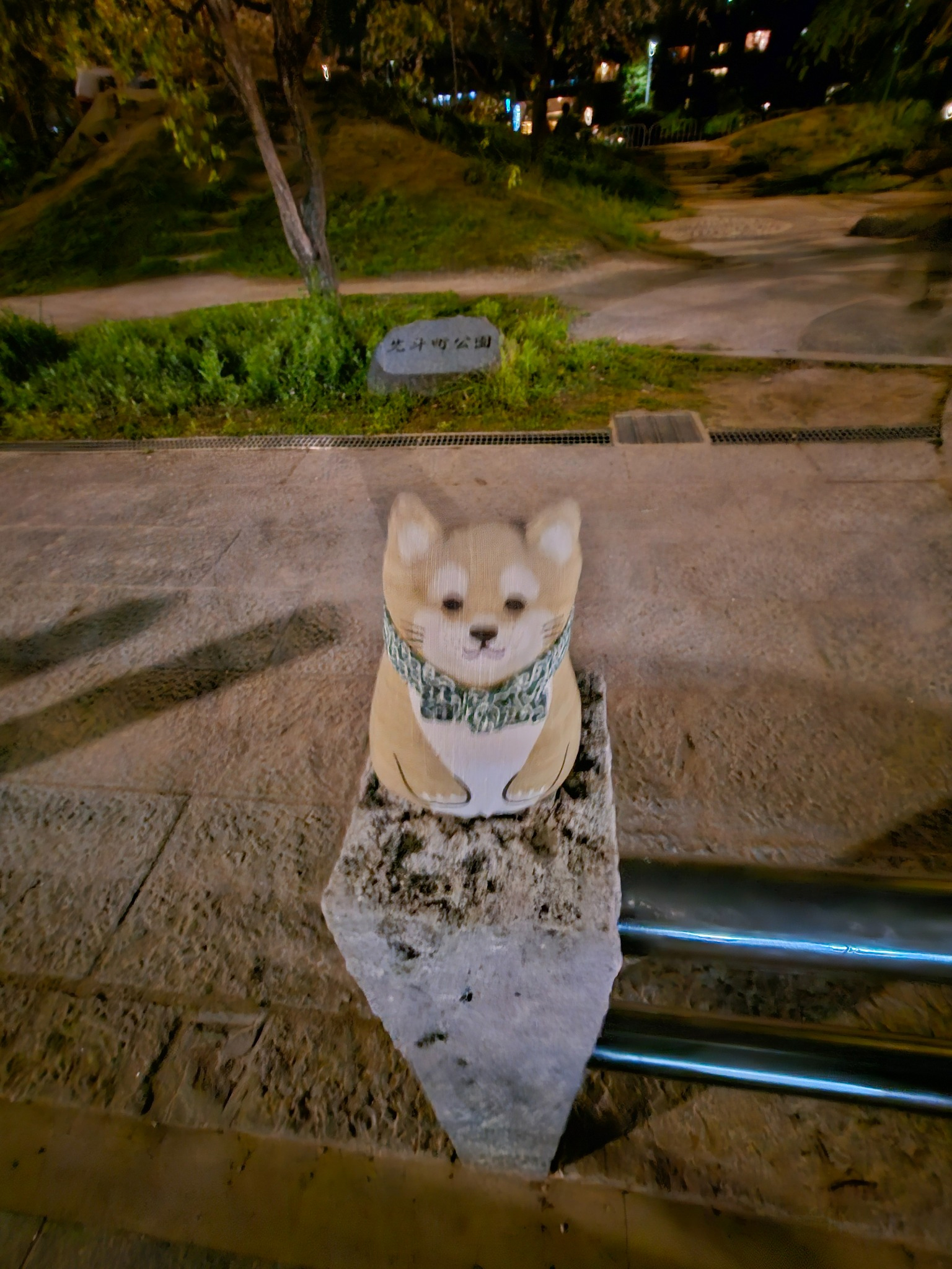 Small dog statue at night in Kyoto.